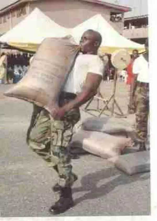 Wawu! Soldier Spotted Lifting Heavy Sack With His Mouth During Training (See Photos)